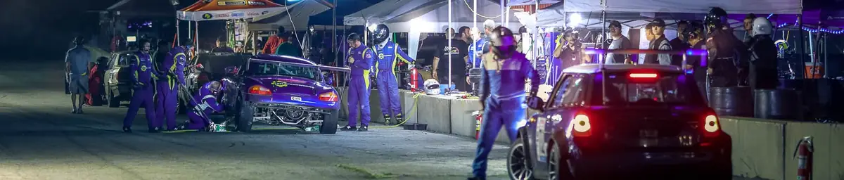 Night time pit stops under the lights at a ChampCar event