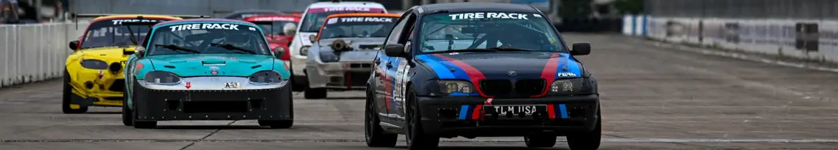 ChampCar pack racing down the Sebring concrete runway